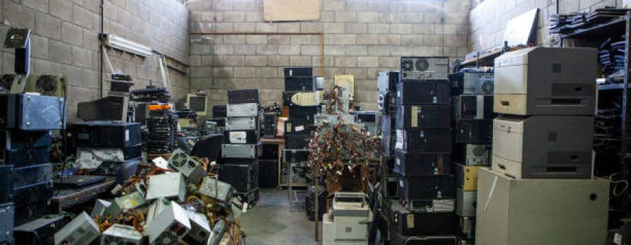 Wide shot of recycling plant storage full of obsolete computer electronics equipment
